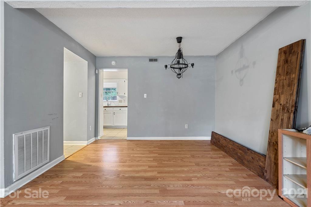 10953 Park Road Charlotte, NC 28226 - Photo 6 of 17 a view of an empty room with closet and a window