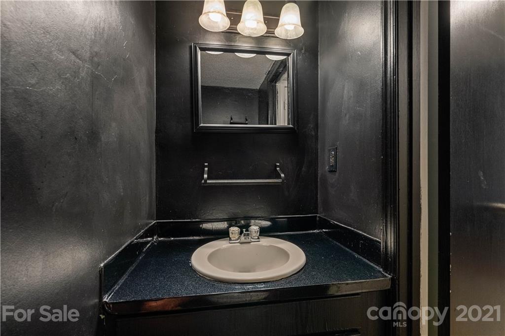 10953 Park Road Charlotte, NC 28226 - Photo 8 of 17 a bathroom with a sink and a mirror