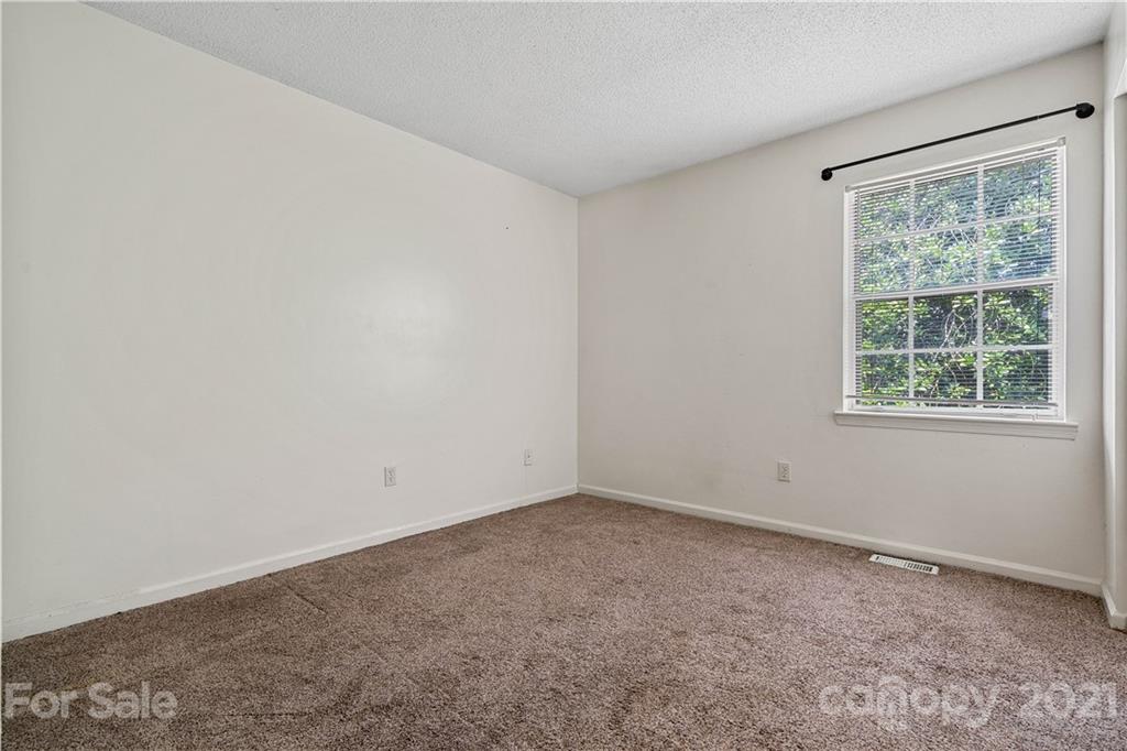 10953 Park Road Charlotte, NC 28226 - Photo 10 of 17 an empty room with a window