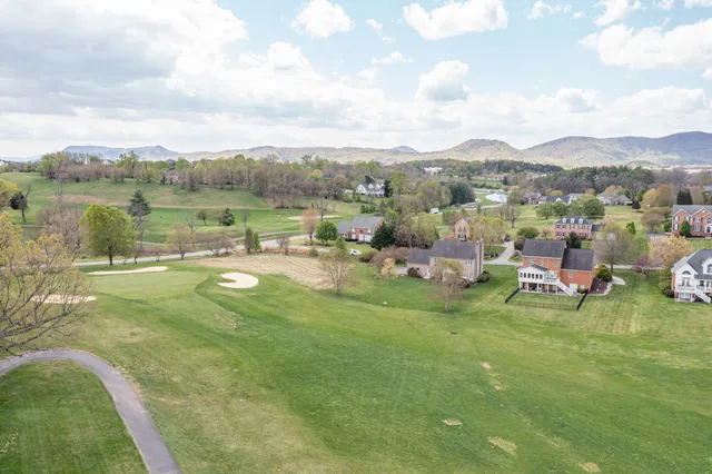 a view of a garden with houses
