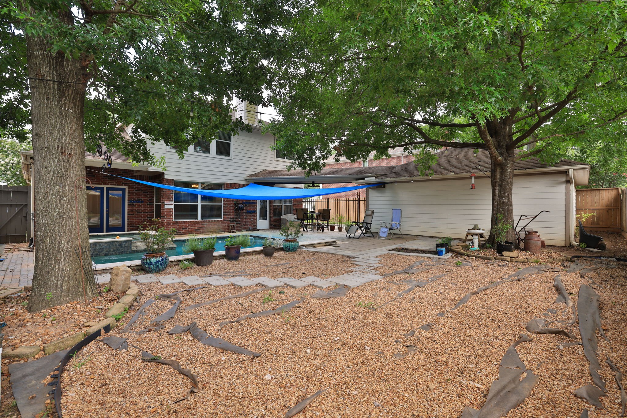 19114 Emory Trail Spring, TX 77388 - Photo 42 of 44 a wooden bench sitting in front of a house