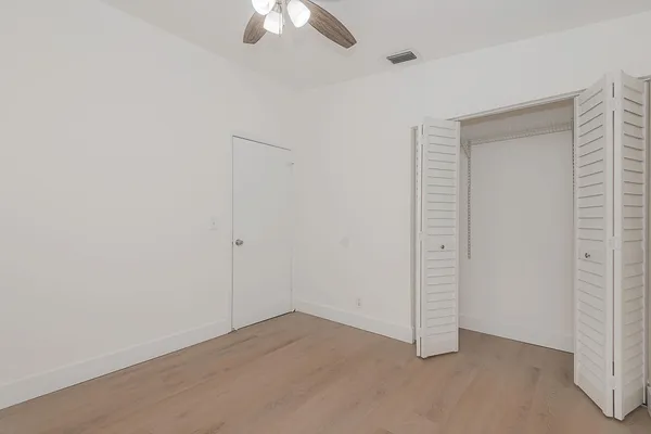 a close up view of a utility room with washer and dryer