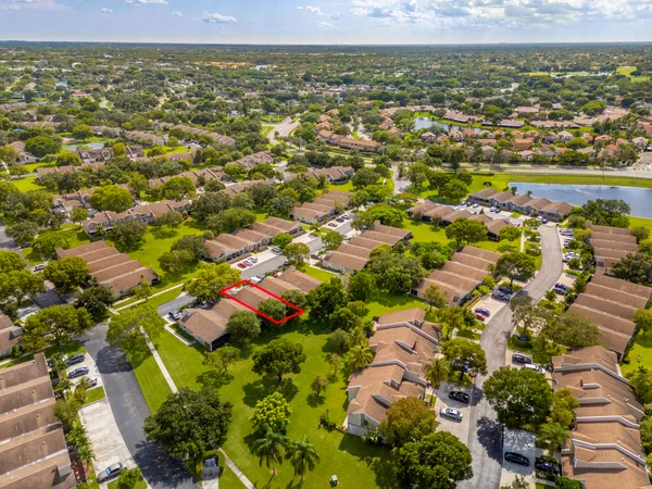 an aerial view of residential houses with outdoor space