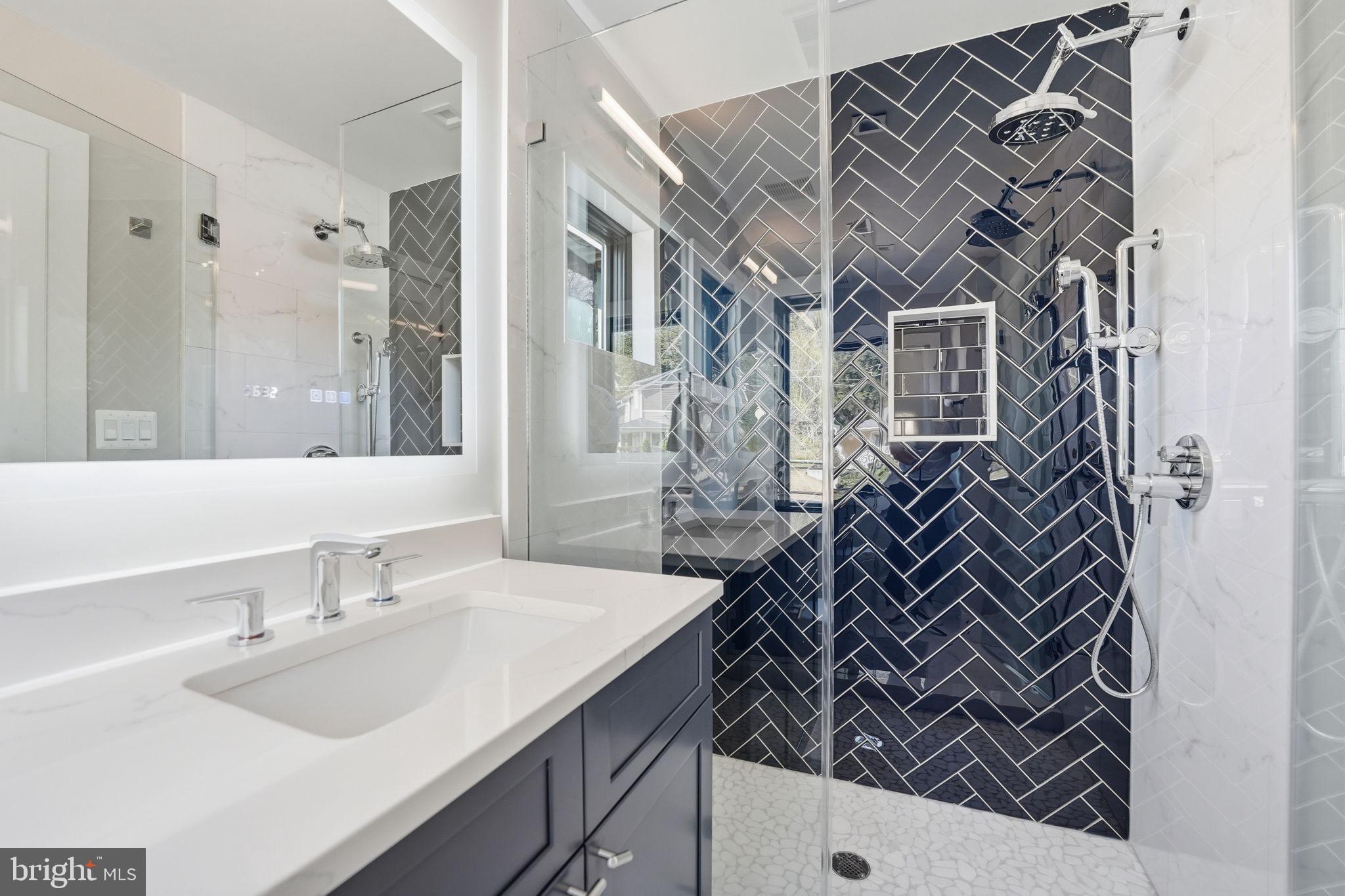 2211 Military Road Arlington, VA 22207 - Photo 34 of 107 Sleek modern bathroom with elegant tiles.