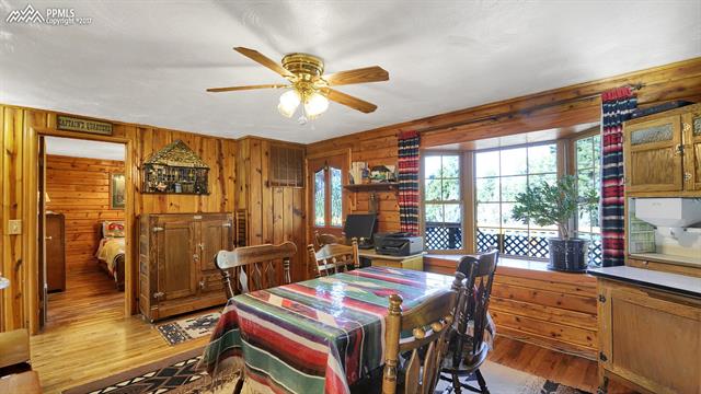6475 Burrows Road Colorado Springs, CO 80908 - Photo 19 of 30 front room/dining area. Custom made bay windows to enjoy the forest views and wildlife.