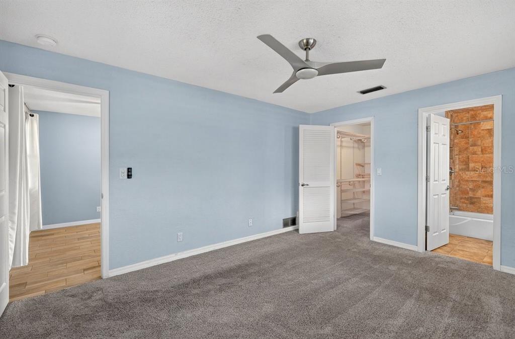 1309 Suwanee Road Daytona Beach, FL 32114 - Photo 16 of 33 a view of an empty room with a ceiling fan