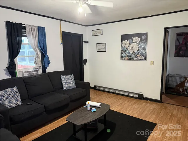 a living room with furniture and a rug