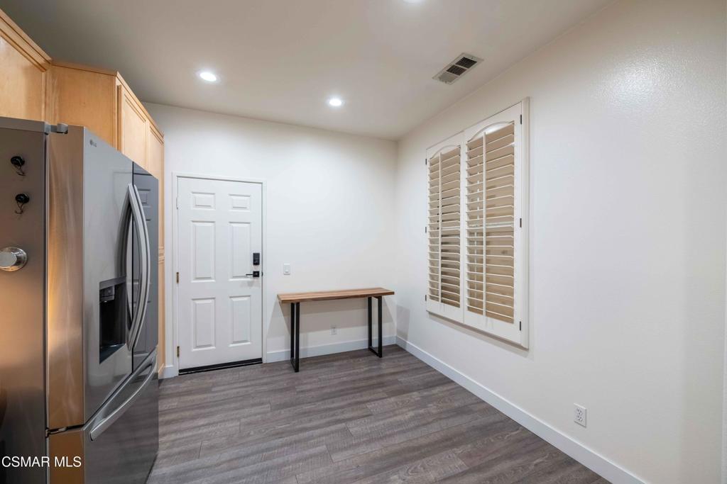580 Fenwick Way, Unit C Simi Valley, CA 93065 - Photo 14 of 39 a view of empty room with wooden floor and window