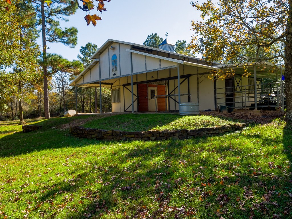 26173 Crown Ranch Boulevard Montgomery, TX 77316 - Photo 11 of 37 a view of a house with backyard and garden