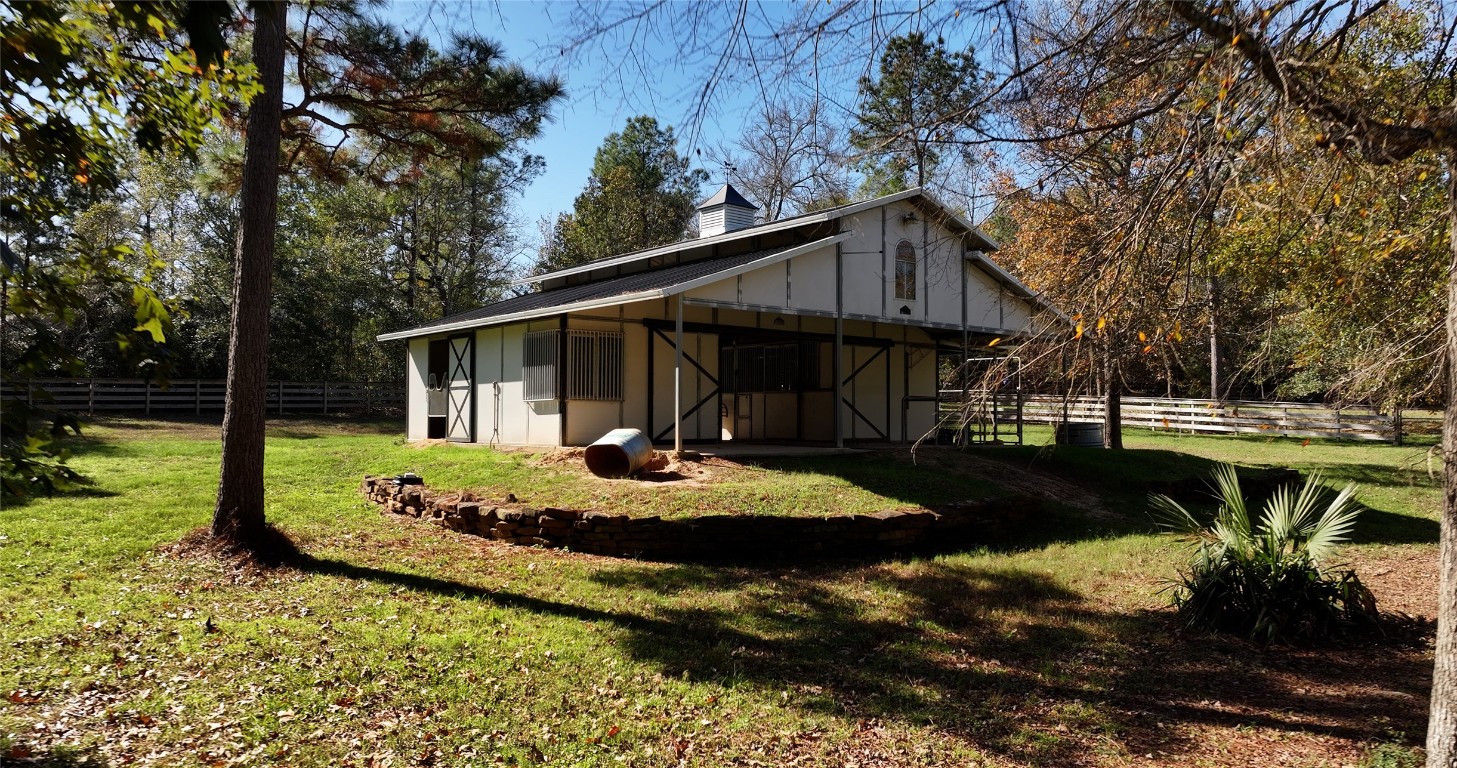 26173 Crown Ranch Boulevard Montgomery, TX 77316 - Photo 15 of 37 a view of a house with backyard and sitting area