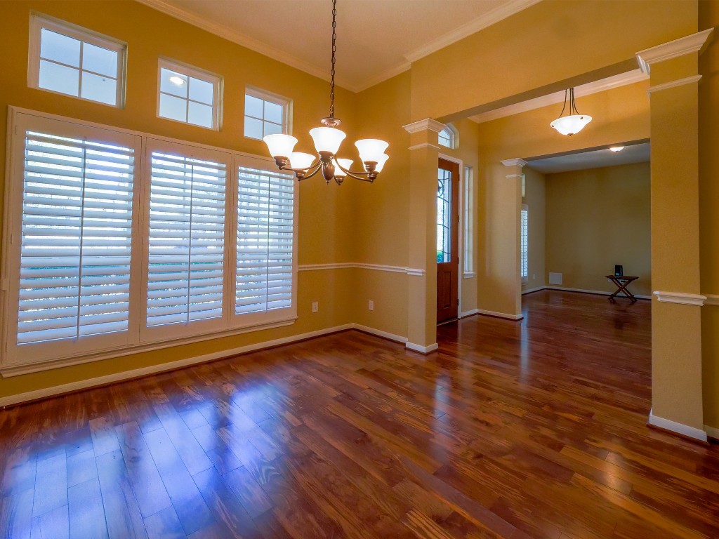 26173 Crown Ranch Boulevard Montgomery, TX 77316 - Photo 33 of 37 a view of a livingroom with wooden floor and a ceiling fan