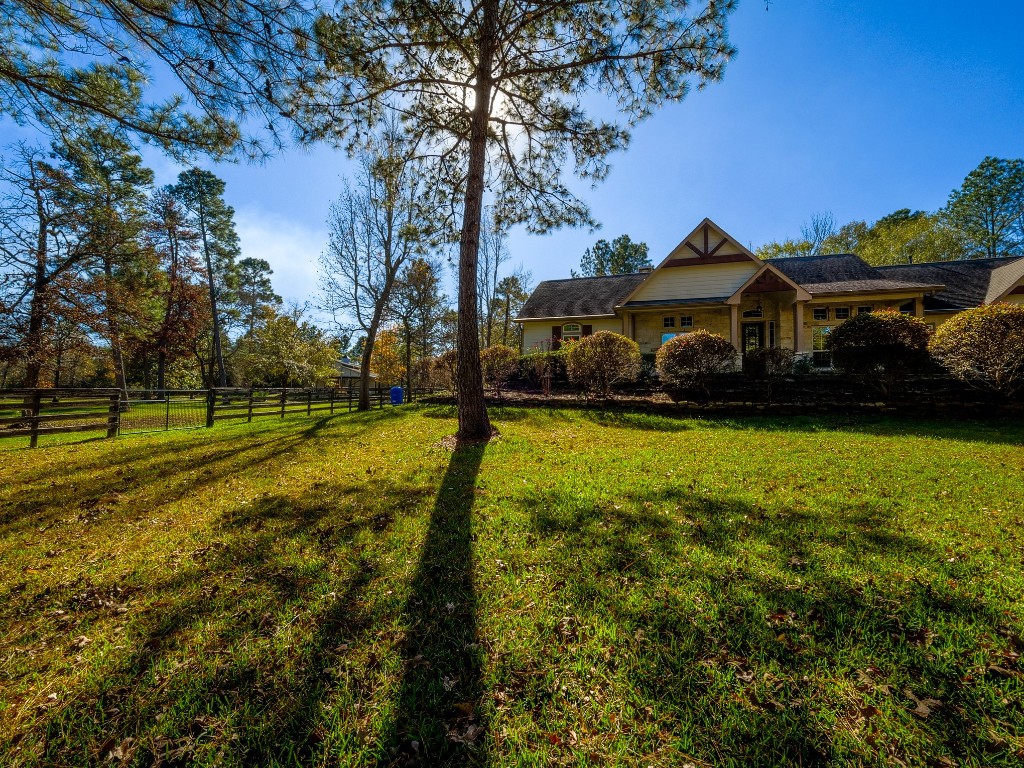 26173 Crown Ranch Boulevard Montgomery, TX 77316 - Photo 35 of 37 a view of a yard with small plants and trees