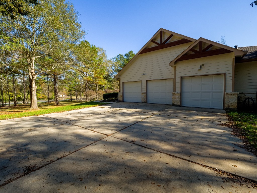 26173 Crown Ranch Boulevard Montgomery, TX 77316 - Photo 37 of 37 a view of a house with a yard