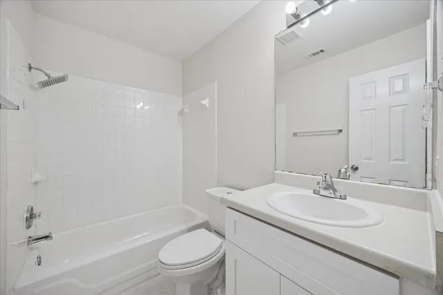 a bathroom with a sink toilet and a bathtub
