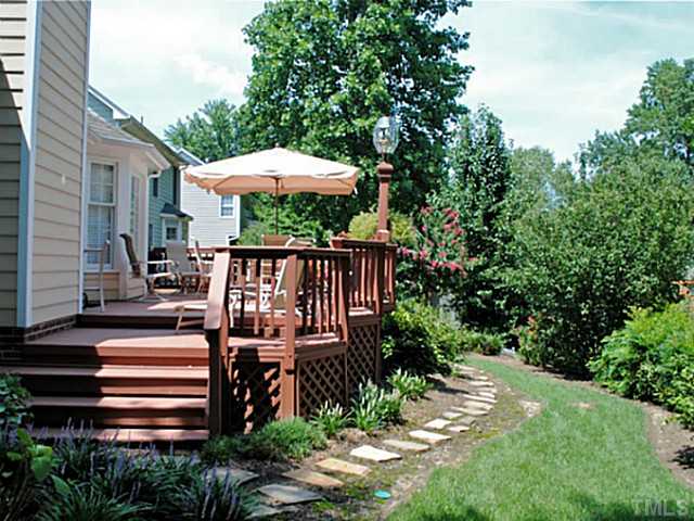 11213 North Radner Way Raleigh, NC 27613 - Photo 15 of 18 a view of a wooden deck in front of house