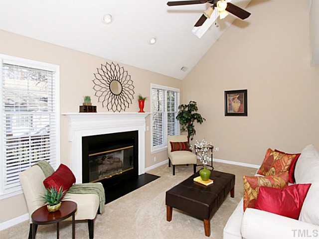 11213 North Radner Way Raleigh, NC 27613 - Photo 4 of 18 a living room with furniture and a fireplace