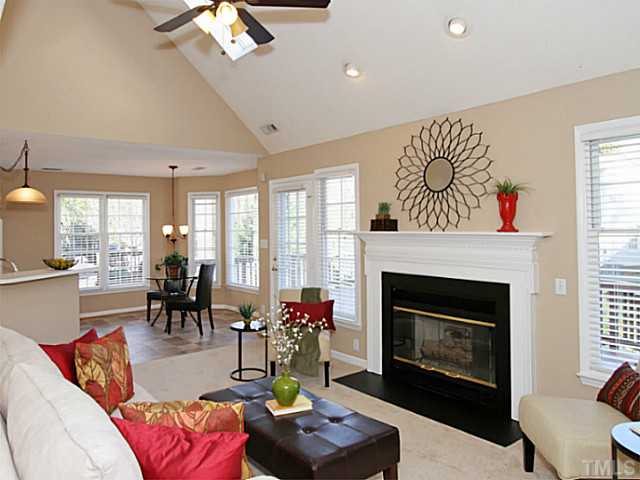 11213 North Radner Way Raleigh, NC 27613 - Photo 5 of 18 a living room with furniture fireplace and a large window