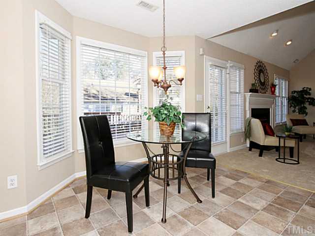 11213 North Radner Way Raleigh, NC 27613 - Photo 8 of 18 a view of a dining room with furniture window and outside view