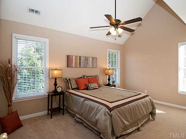 11213 North Radner Way Raleigh, NC 27613 - Photo 10 of 18 a bedroom with a bed and window