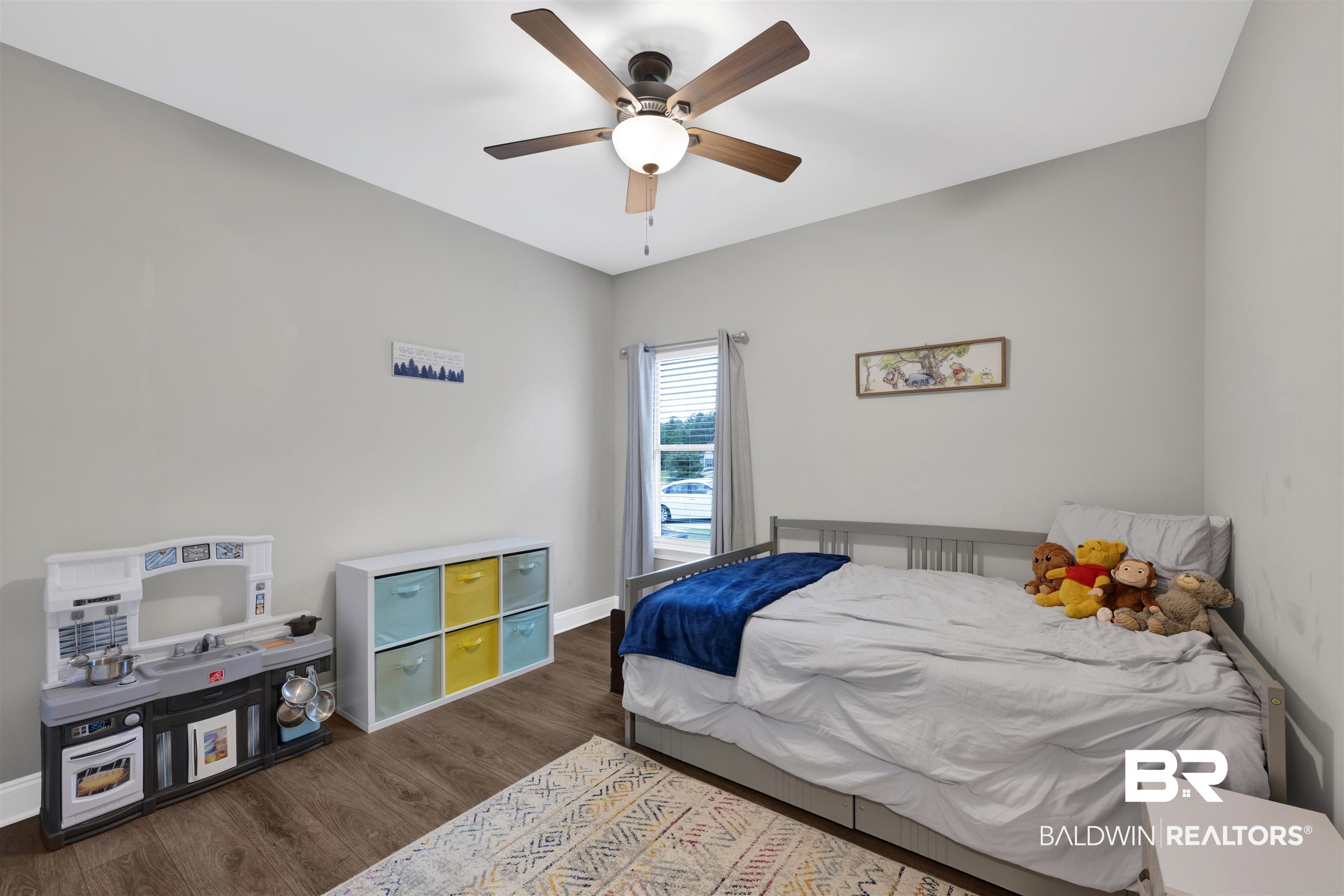 12672 Squirrel Drive Daphne, AL 36527 - Photo 27 of 49 Spacious room featuring wood-finish flooring, a contemporary ceiling fan with integrated lighting, and a window with horizontal blinds