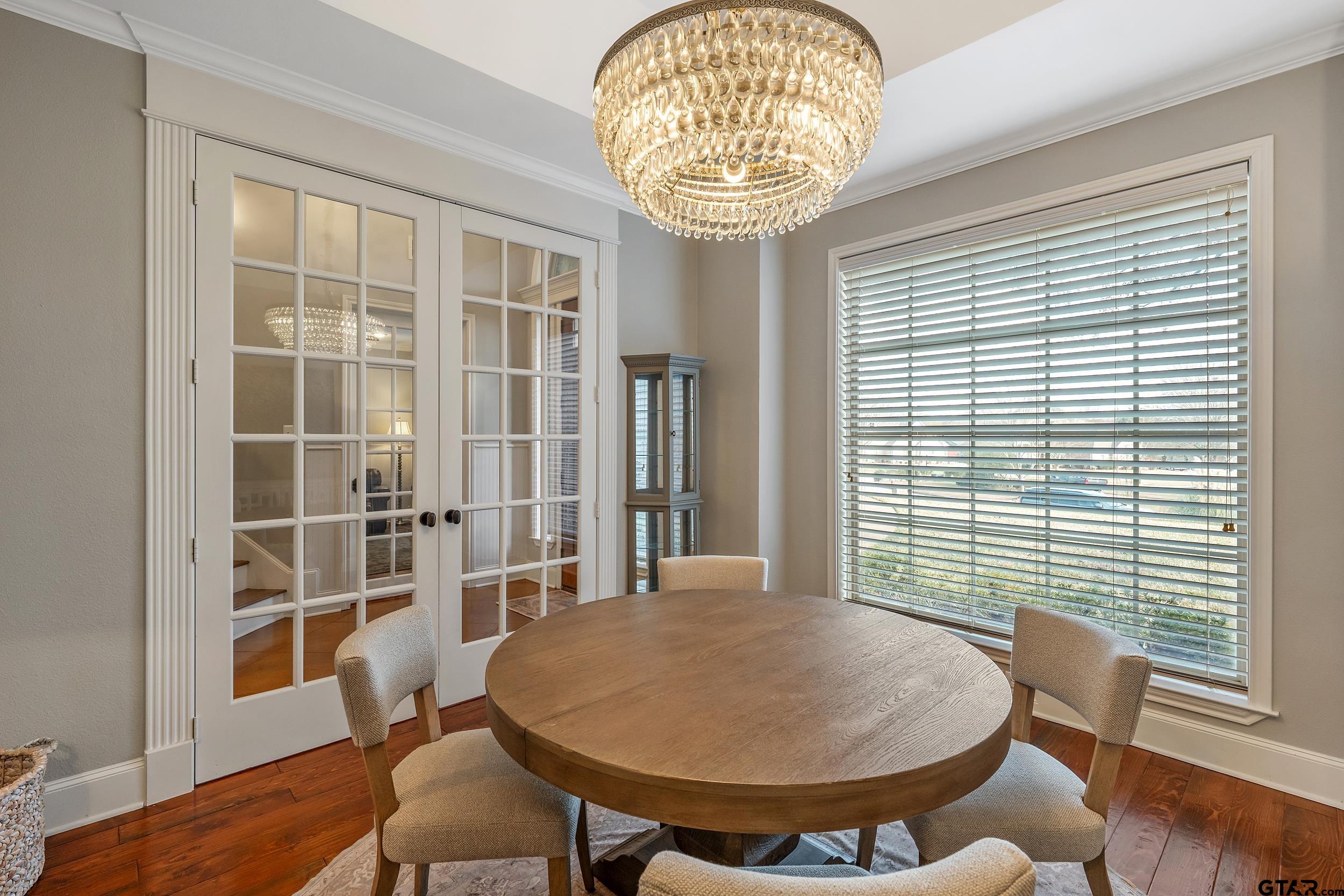 7752 Lamp Post Cove Tyler, TX 75703 - Photo 11 of 41 a view of a dining room with furniture window and wooden floor