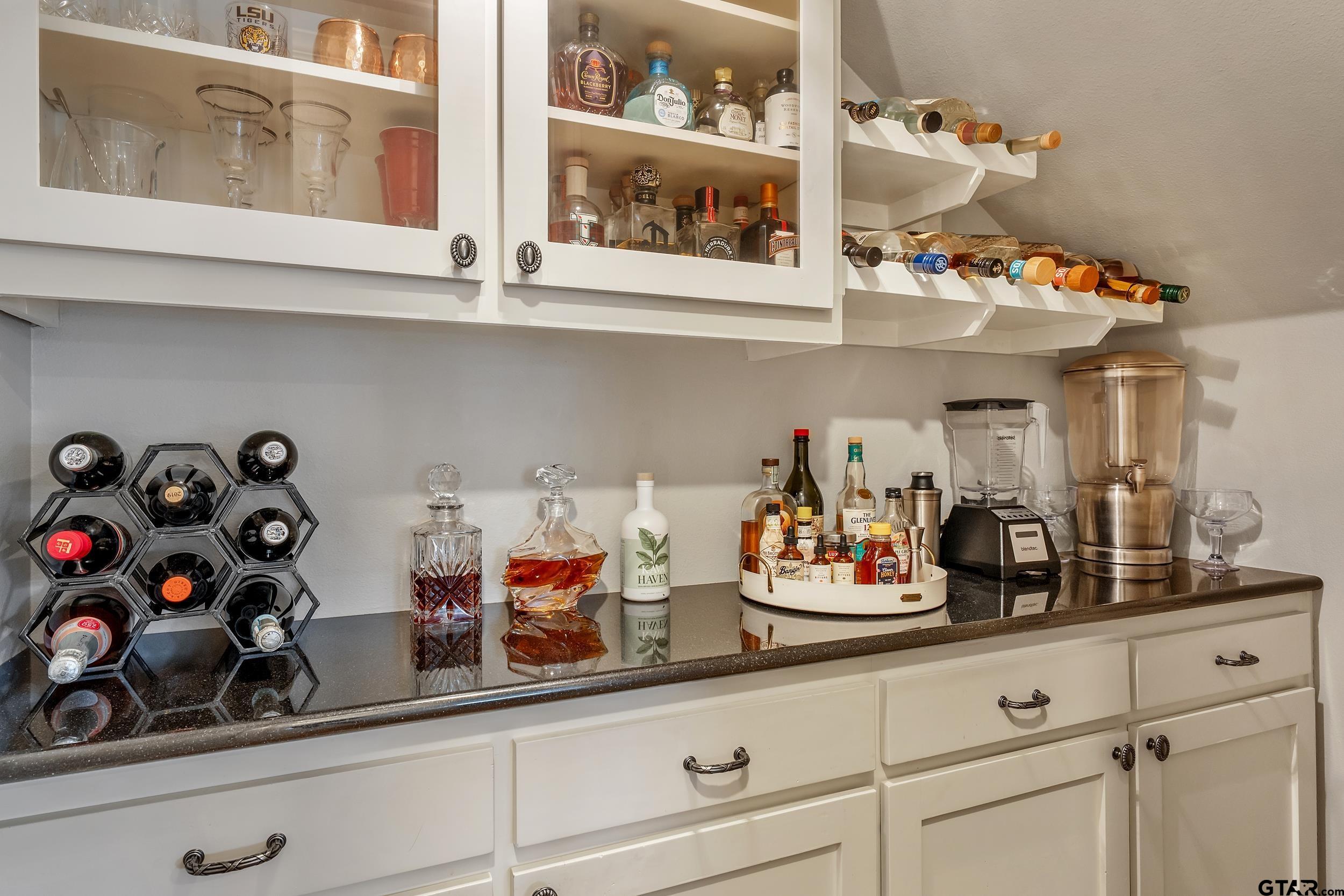 7752 Lamp Post Cove Tyler, TX 75703 - Photo 15 of 41 a kitchen with a microwave a lots of counter space and cabinets