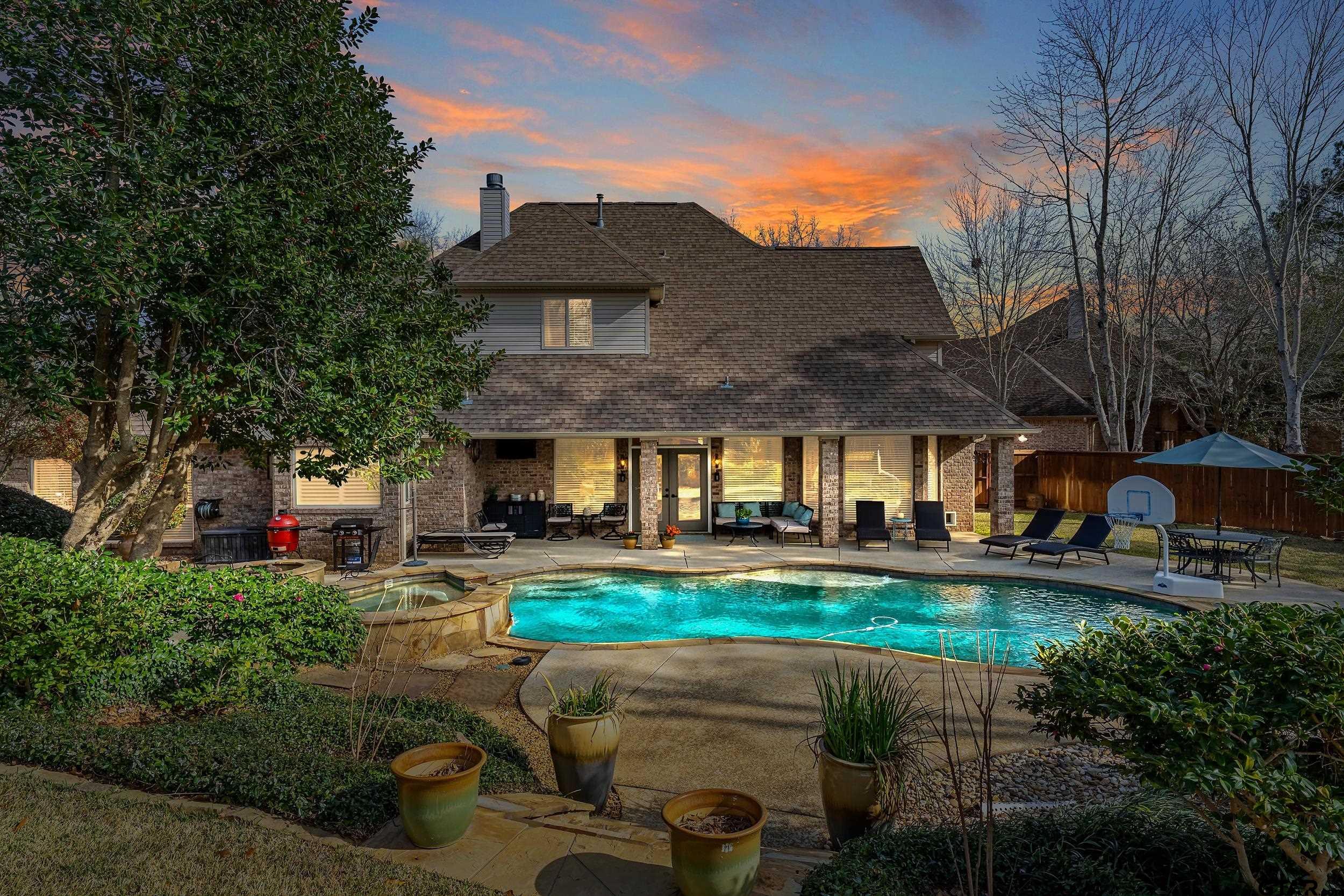 7752 Lamp Post Cove Tyler, TX 75703 - Photo 2 of 41 a view of a house with garden and sitting area