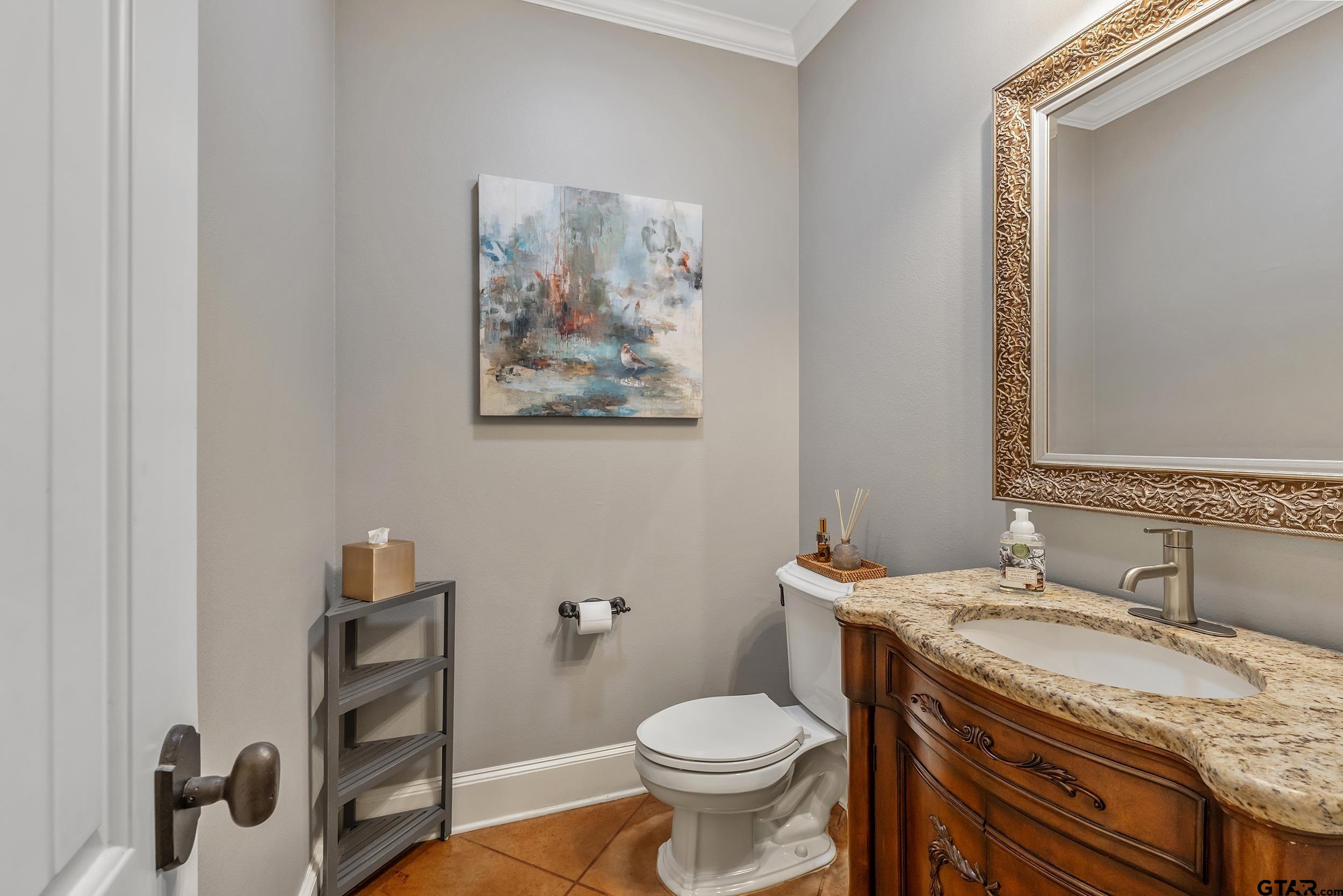 7752 Lamp Post Cove Tyler, TX 75703 - Photo 22 of 41 a bathroom with a granite countertop toilet sink and mirror