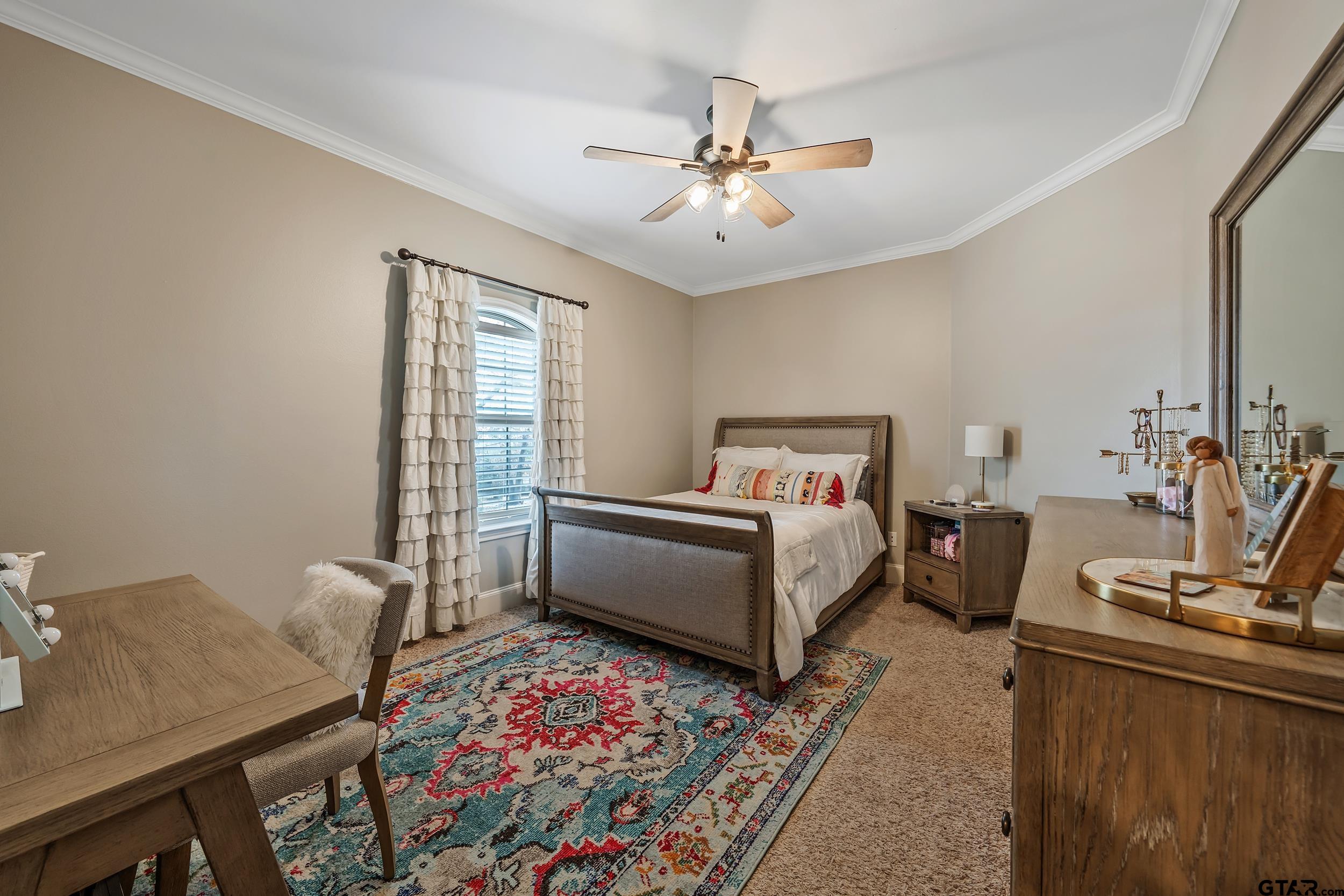 7752 Lamp Post Cove Tyler, TX 75703 - Photo 23 of 41 a bed room with a bed and a chandelier