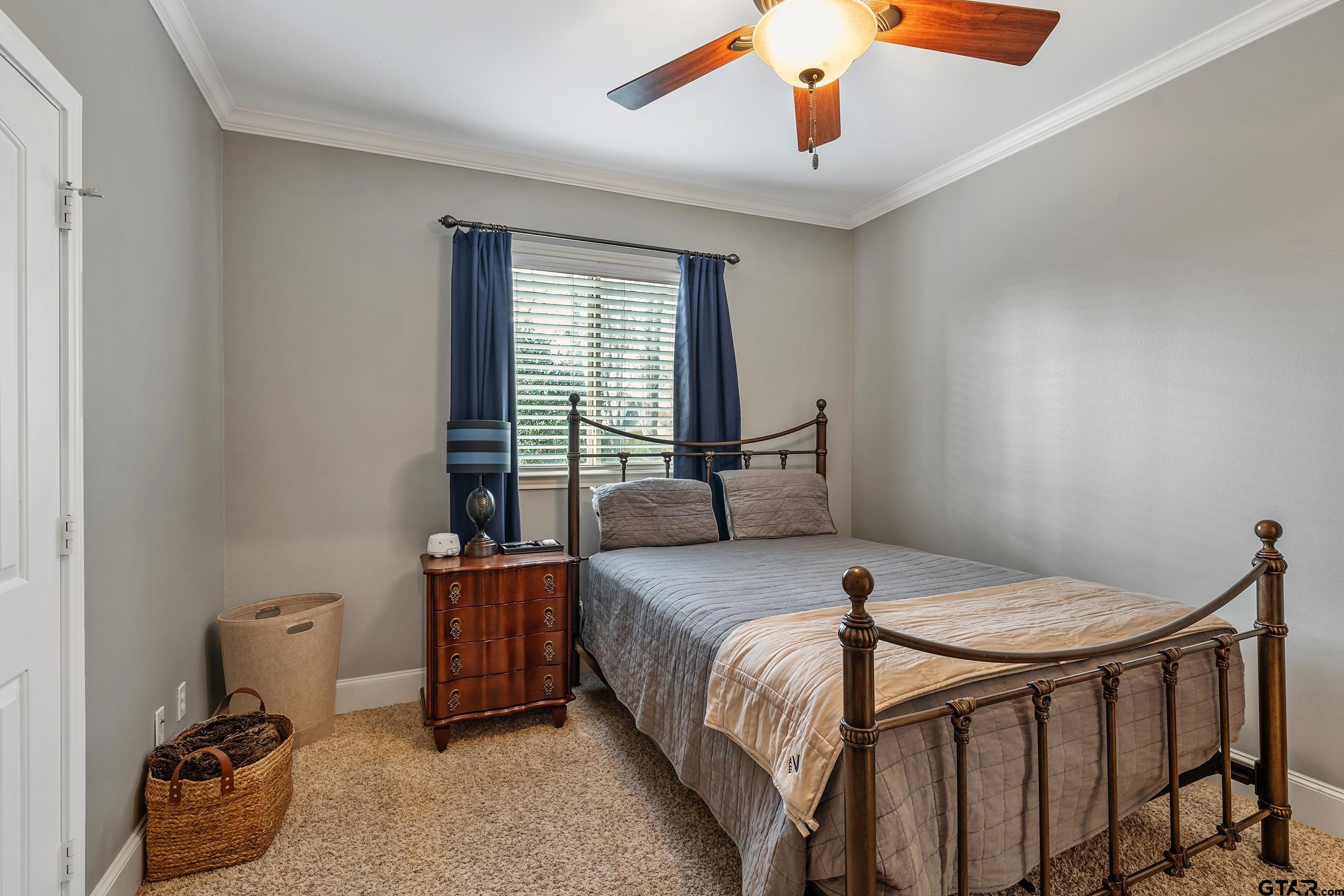 7752 Lamp Post Cove Tyler, TX 75703 - Photo 28 of 41 a bedroom with a bed and window