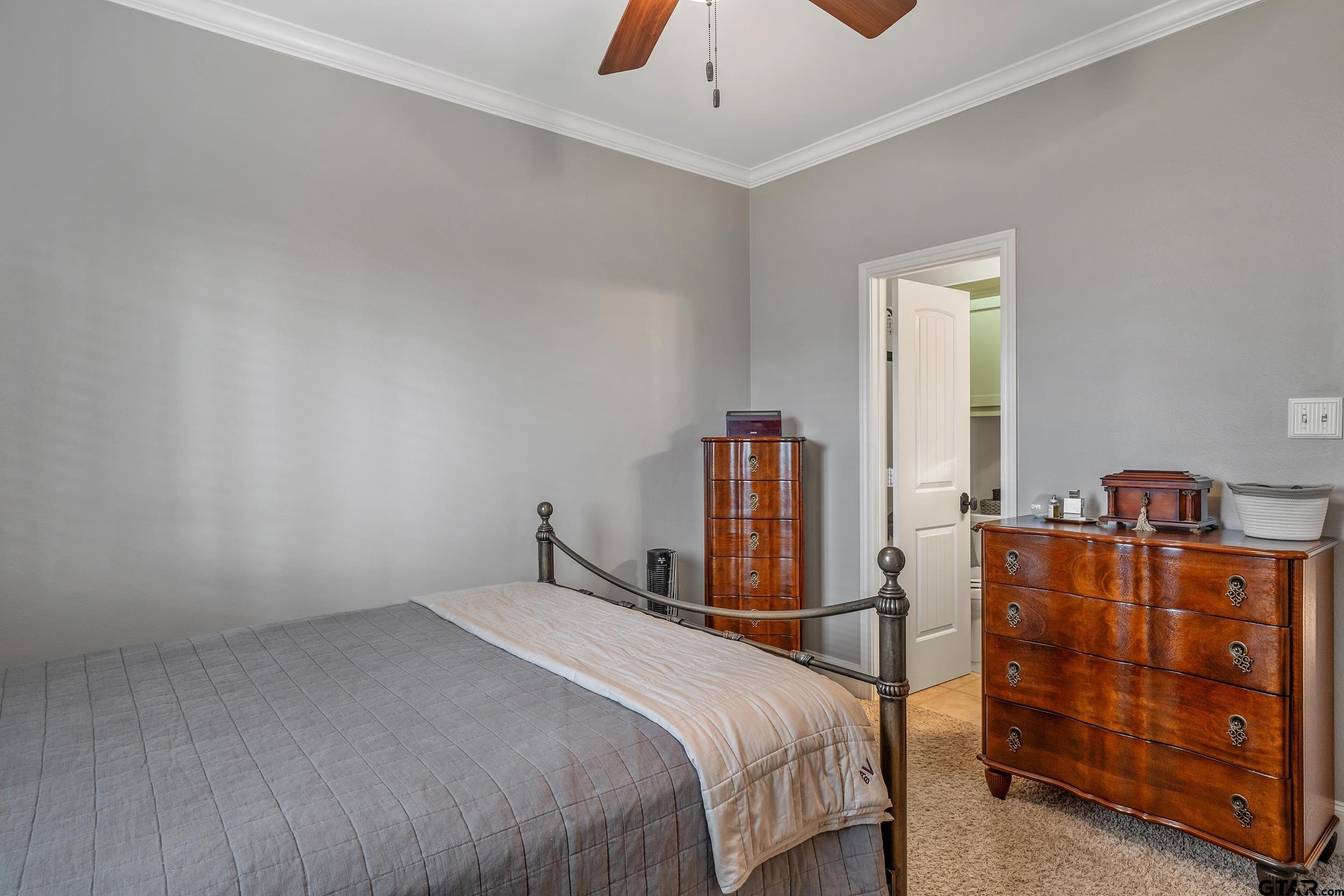 7752 Lamp Post Cove Tyler, TX 75703 - Photo 29 of 41 a bedroom with a bed and dresser