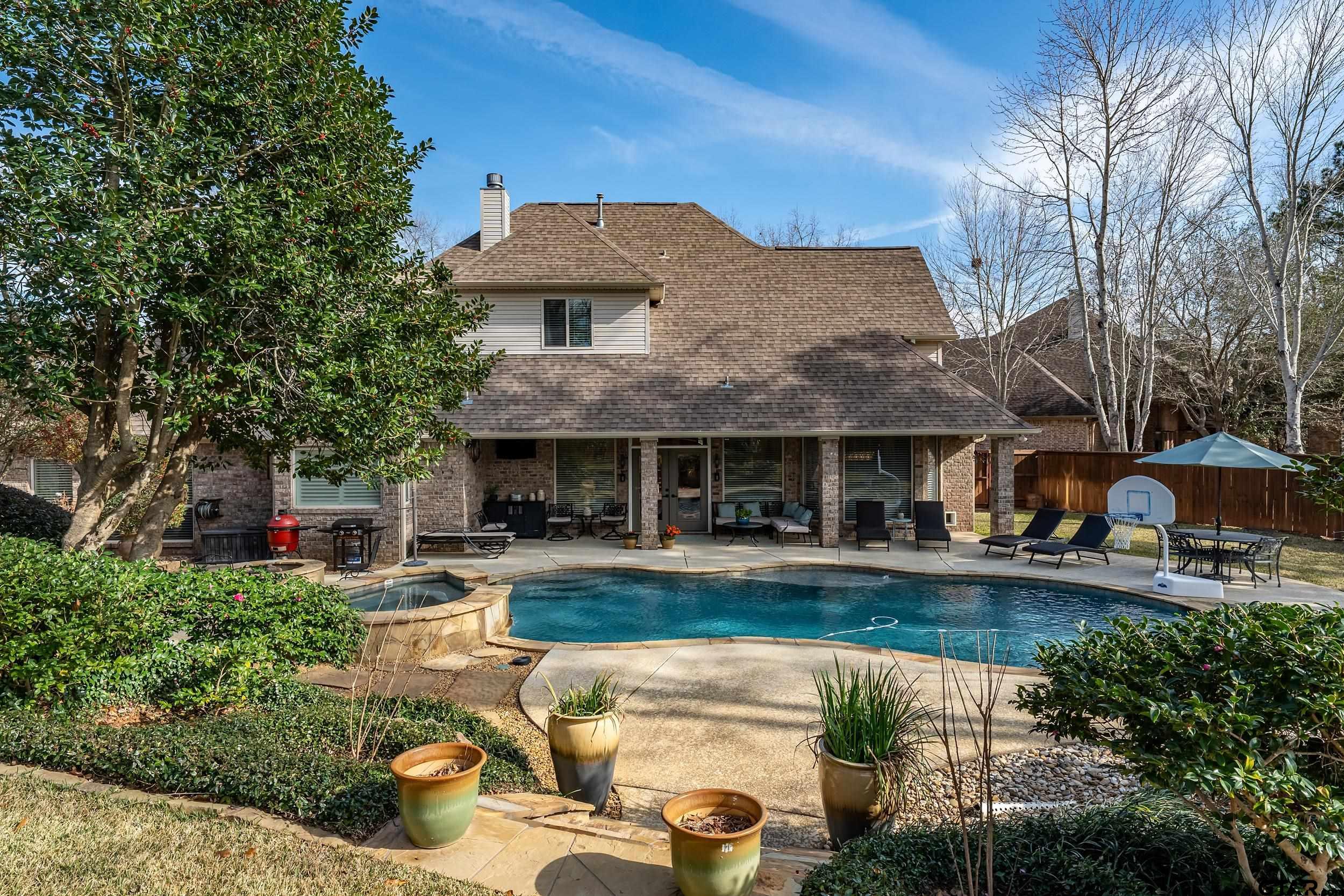7752 Lamp Post Cove Tyler, TX 75703 - Photo 36 of 41 a front view of a house with swimming pool having outdoor seating