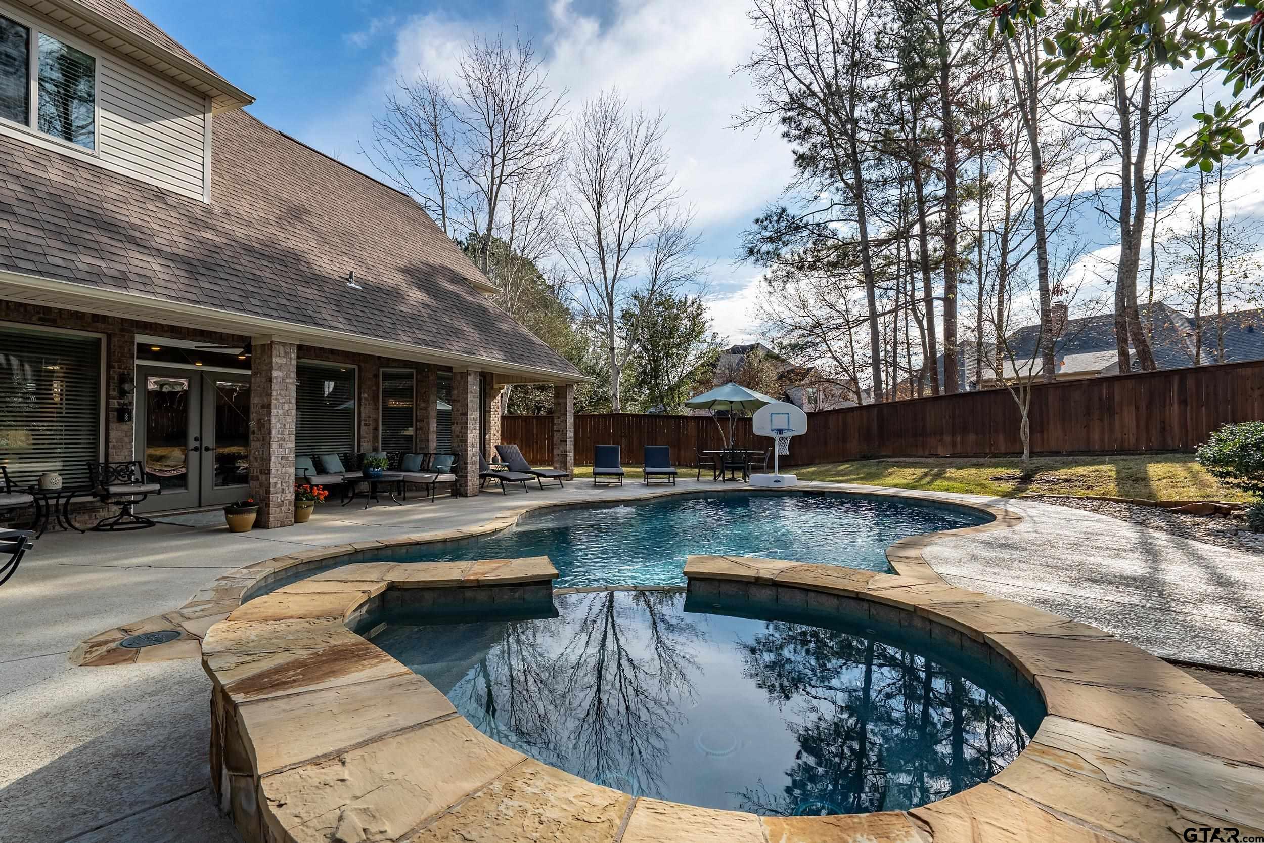 7752 Lamp Post Cove Tyler, TX 75703 - Photo 38 of 41 a view of a swimming pool with chairs