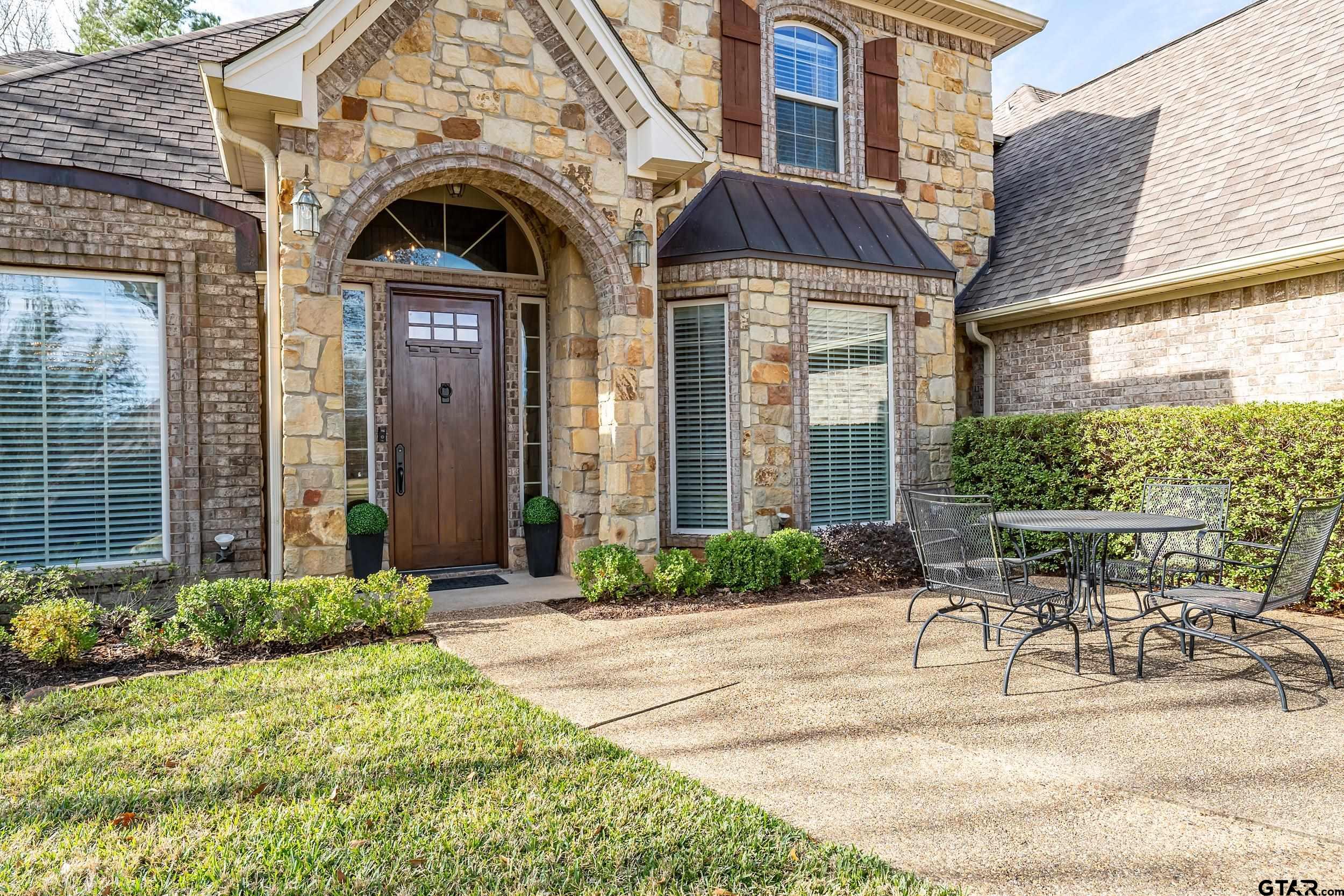7752 Lamp Post Cove Tyler, TX 75703 - Photo 40 of 41 a view of a building with garden and sitting area
