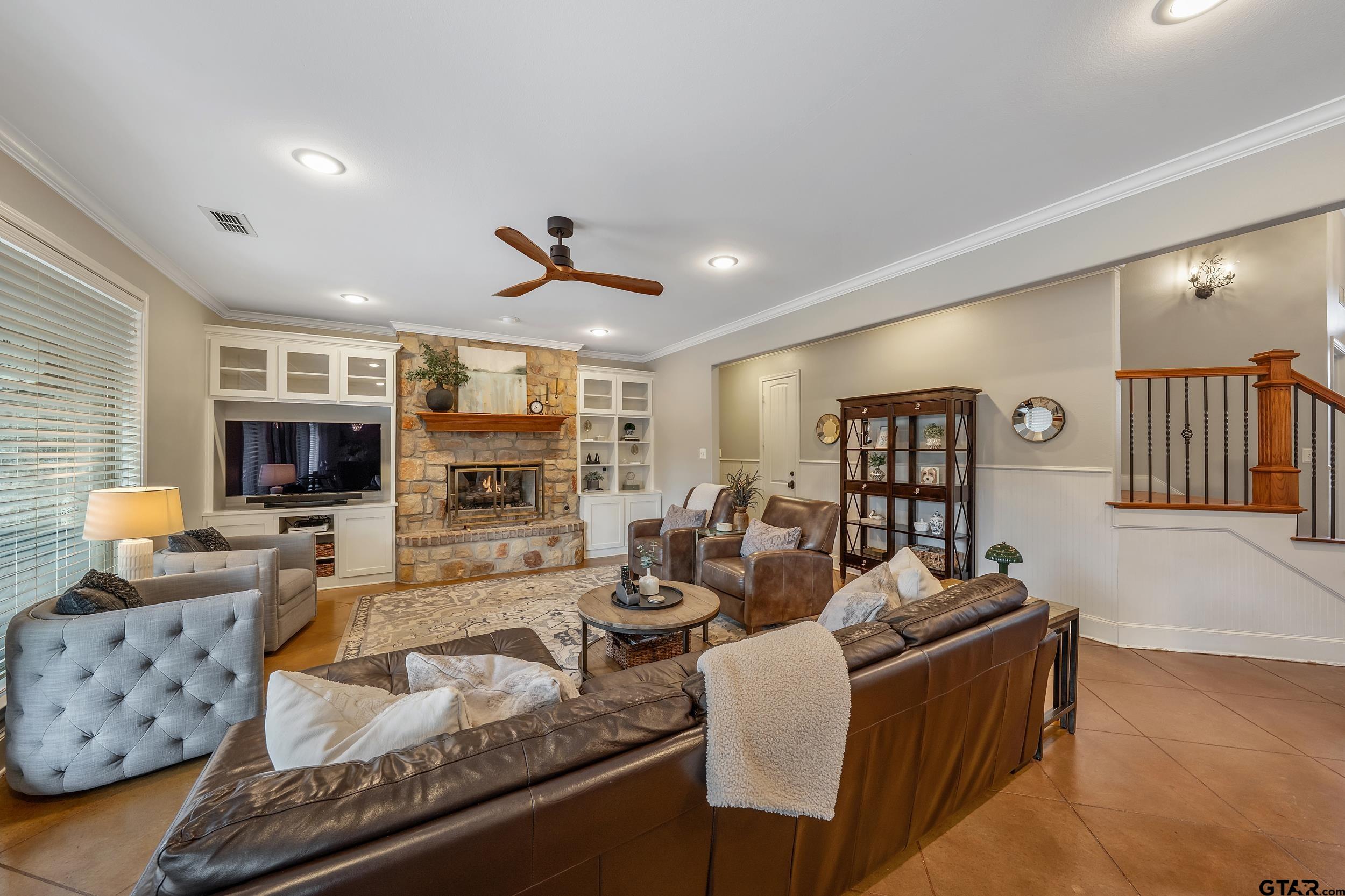 7752 Lamp Post Cove Tyler, TX 75703 - Photo 5 of 41 a living room with fireplace furniture and a flat screen tv