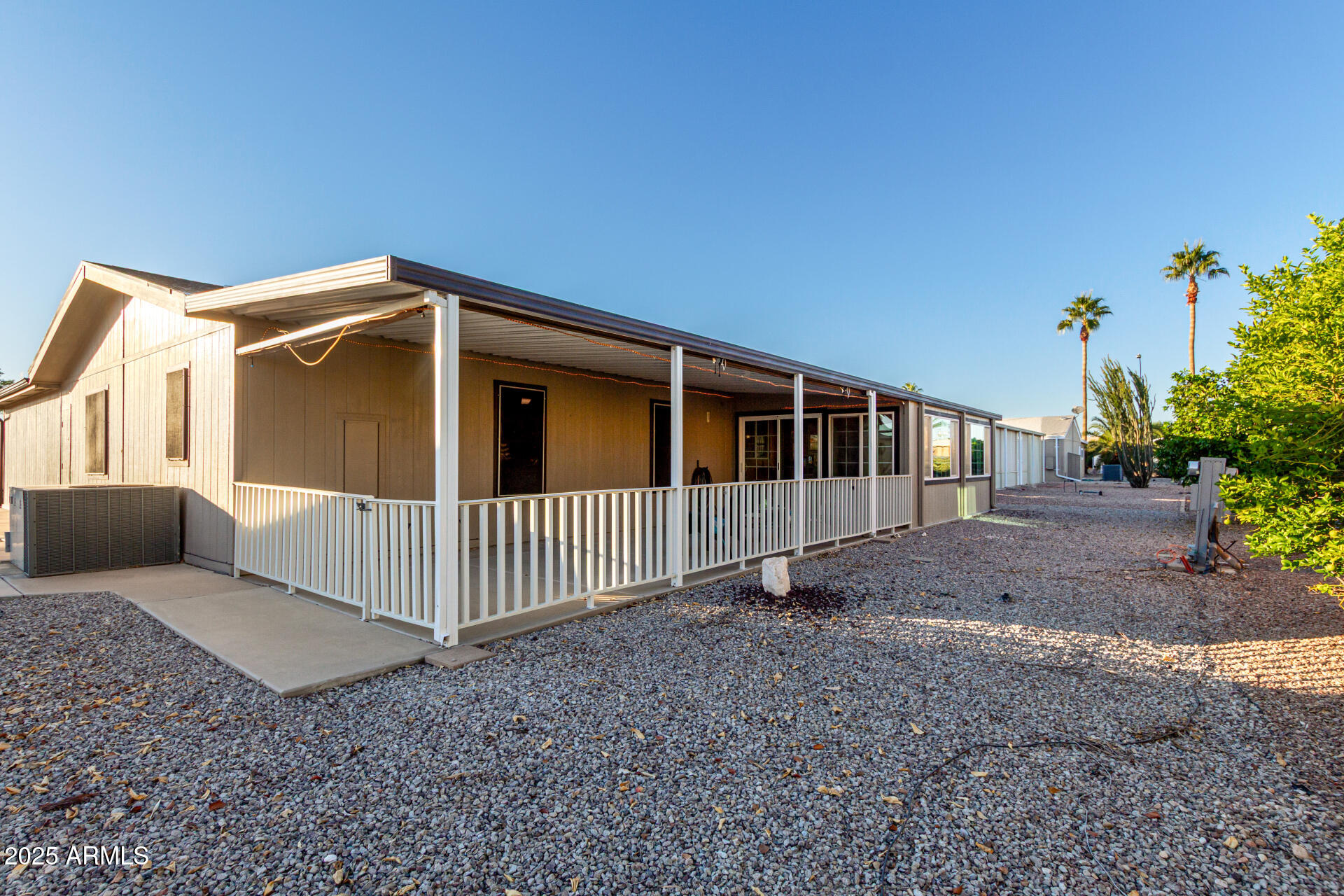2400 East Baseline Road, Unit 248 Apache Junction, AZ 85119 - Photo 13 of 33 a front view of a house with a yard