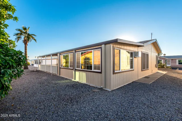 a bed room with a bed and a chandelier