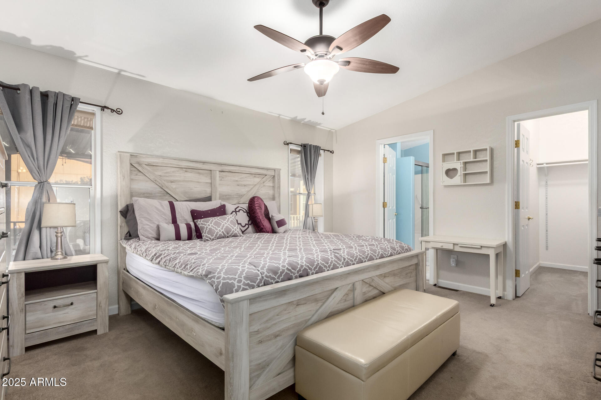 2400 East Baseline Road, Unit 248 Apache Junction, AZ 85119 - Photo 16 of 33 a bed room with a bed and a chandelier