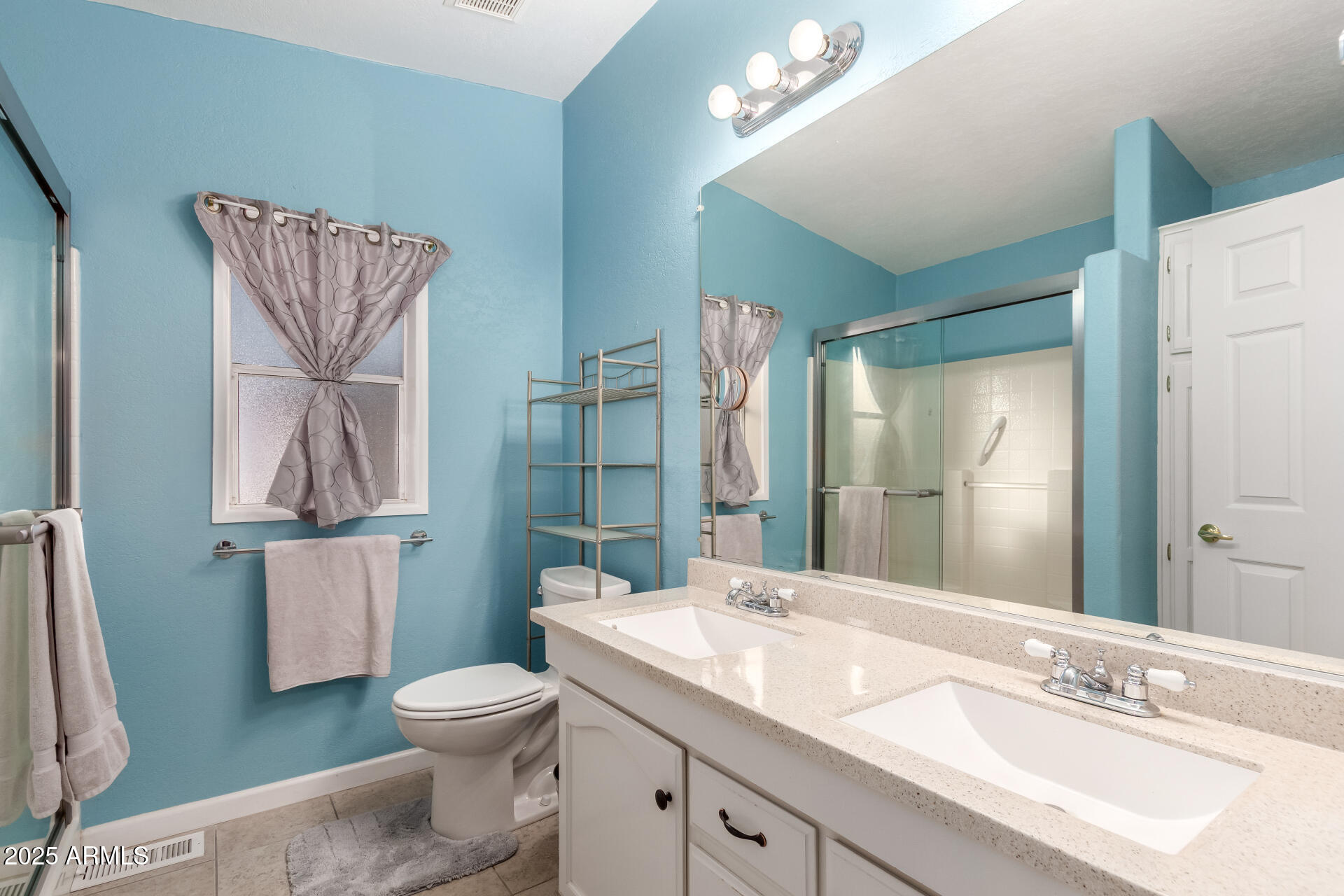 2400 East Baseline Road, Unit 248 Apache Junction, AZ 85119 - Photo 19 of 33 a bathroom with a sink a toilet and shower