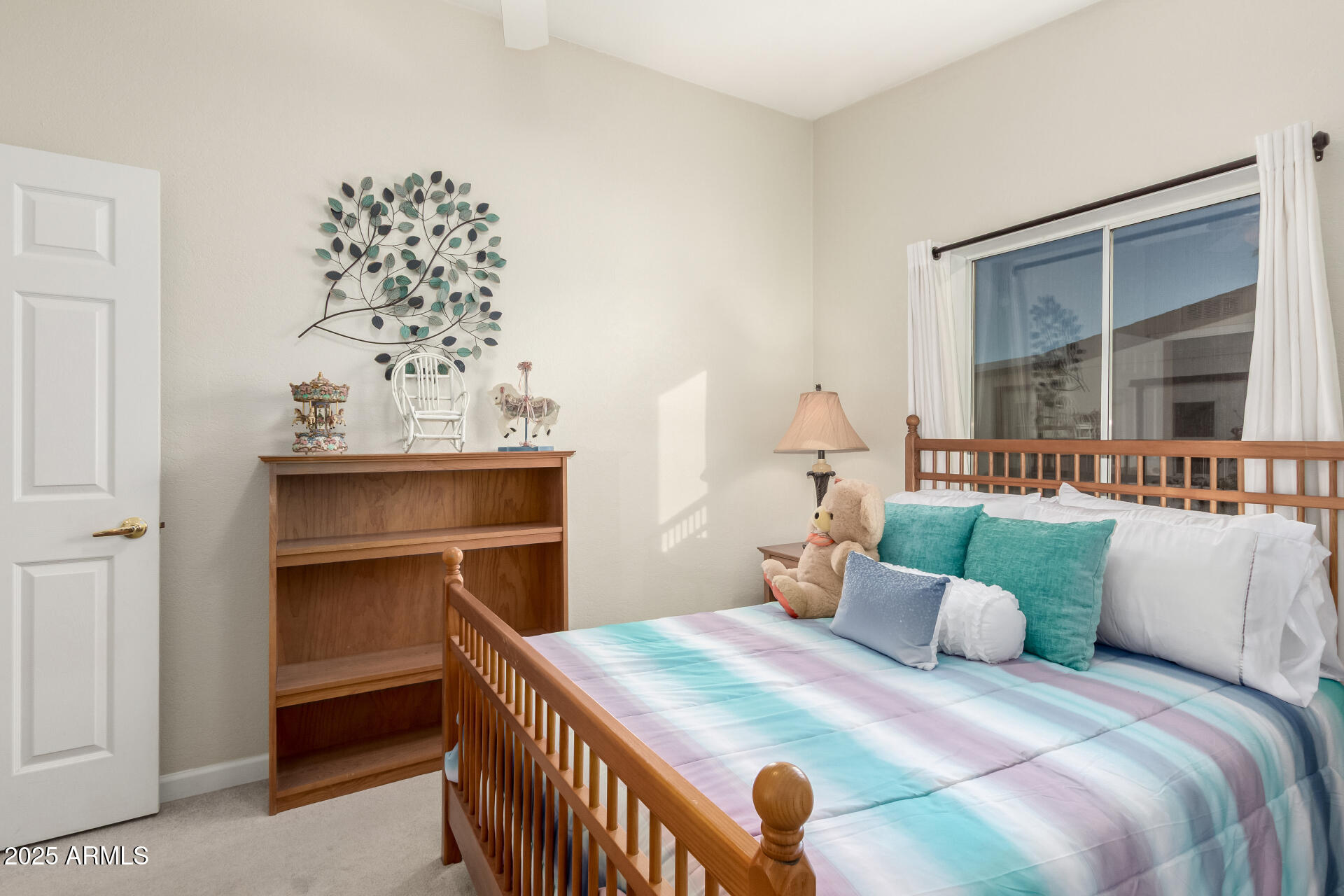 2400 East Baseline Road, Unit 248 Apache Junction, AZ 85119 - Photo 22 of 33 a bedroom with a bed and a chandelier