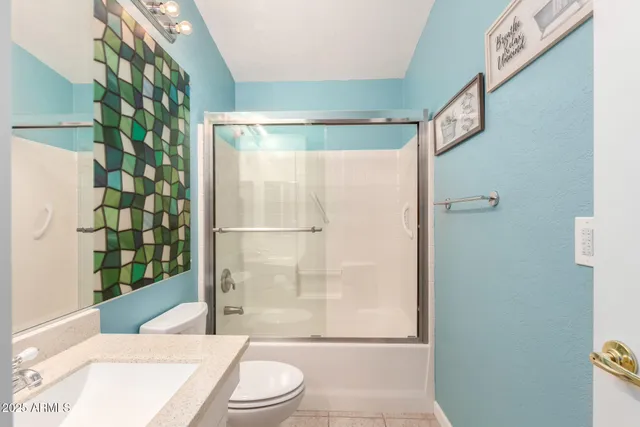 a view of a storage and utility room with washer and dryer
