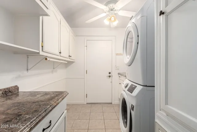 a view of a kitchen with furniture and a ceiling fan