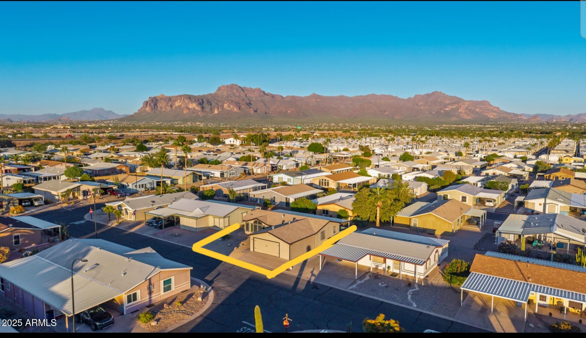 2400 East Baseline Road, Unit 248 Apache Junction, AZ 85119 - Photo 28 of 33 an aerial view of residential houses with outdoor space and trees