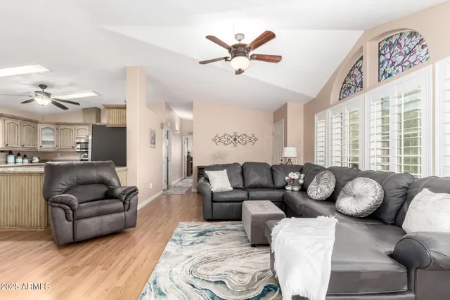 a living room with furniture and a large window