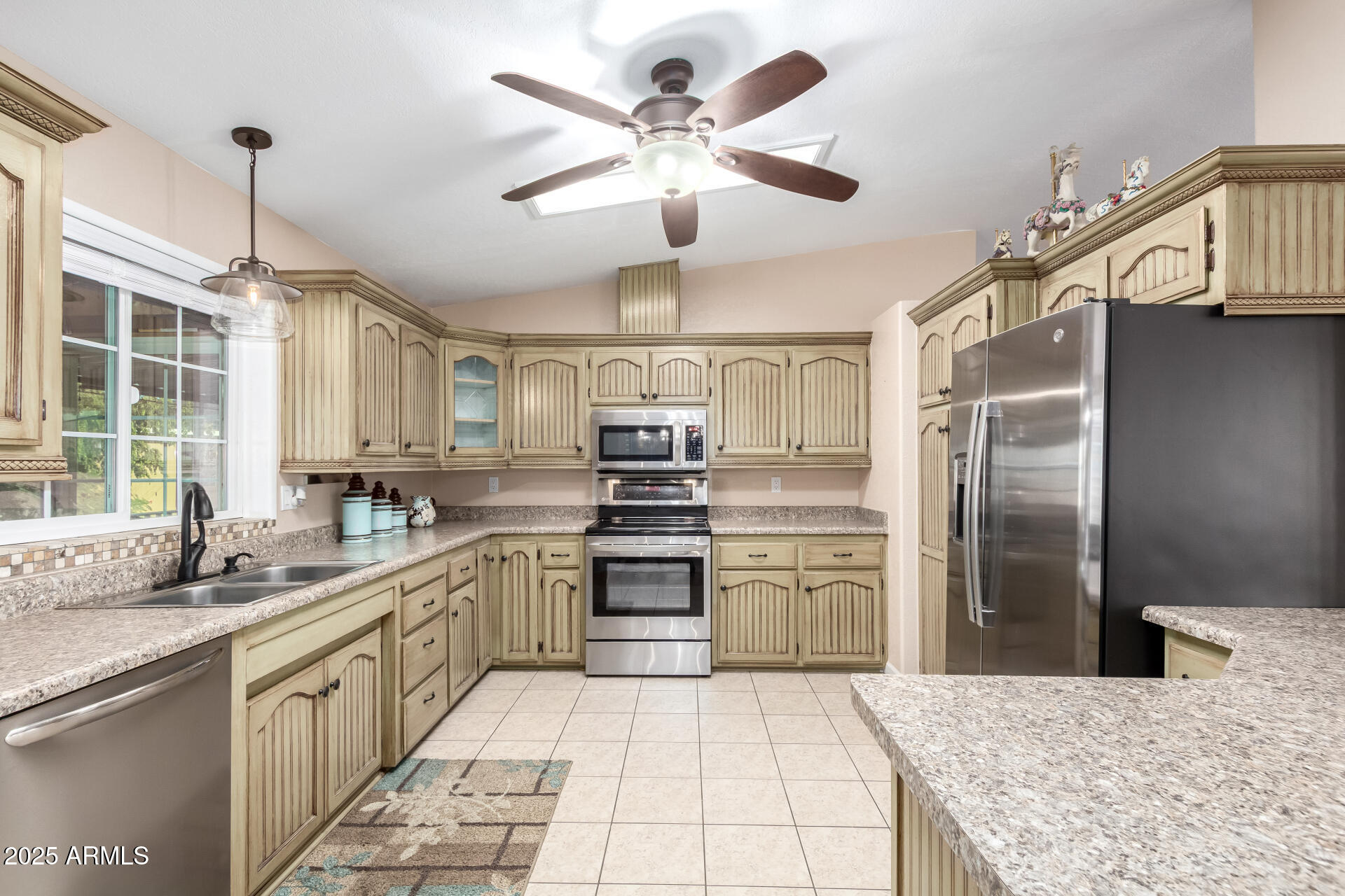 2400 East Baseline Road, Unit 248 Apache Junction, AZ 85119 - Photo 8 of 33 a kitchen with stainless steel appliances granite countertop a sink refrigerator and cabinets