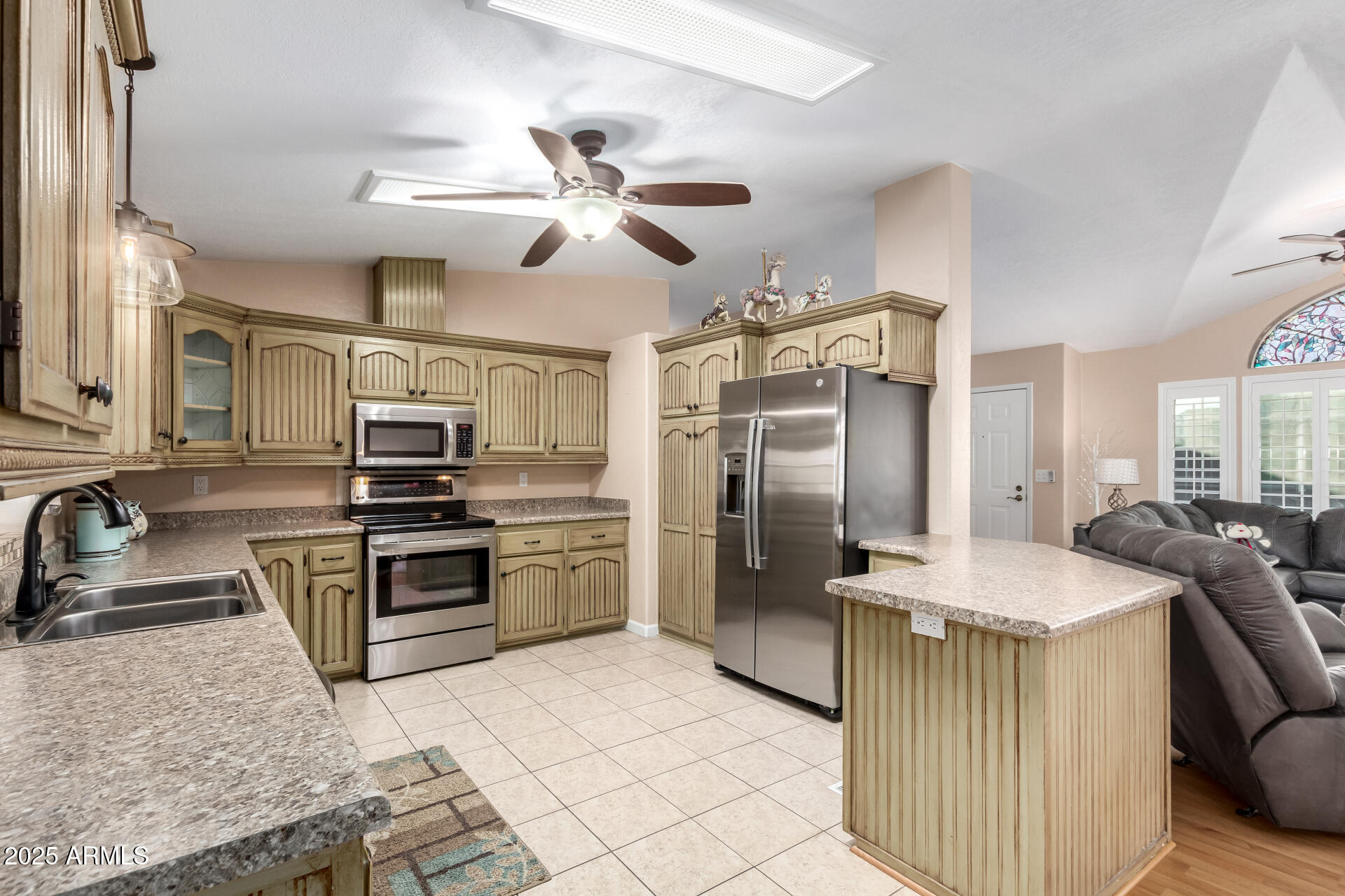 2400 East Baseline Road, Unit 248 Apache Junction, AZ 85119 - Photo 10 of 33 a kitchen with stainless steel appliances granite countertop a sink a stove a refrigerator a washer dryer and a dining table