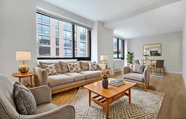 a living room with furniture and window