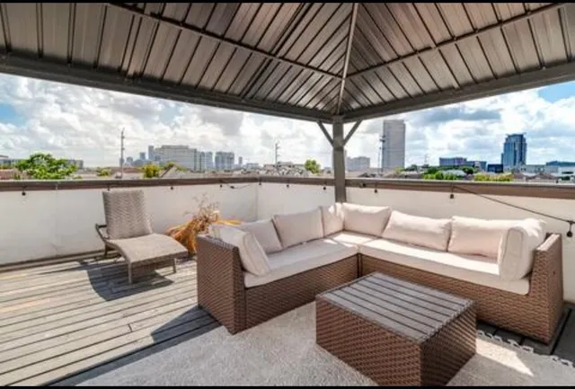 a view of a couches on the roof deck