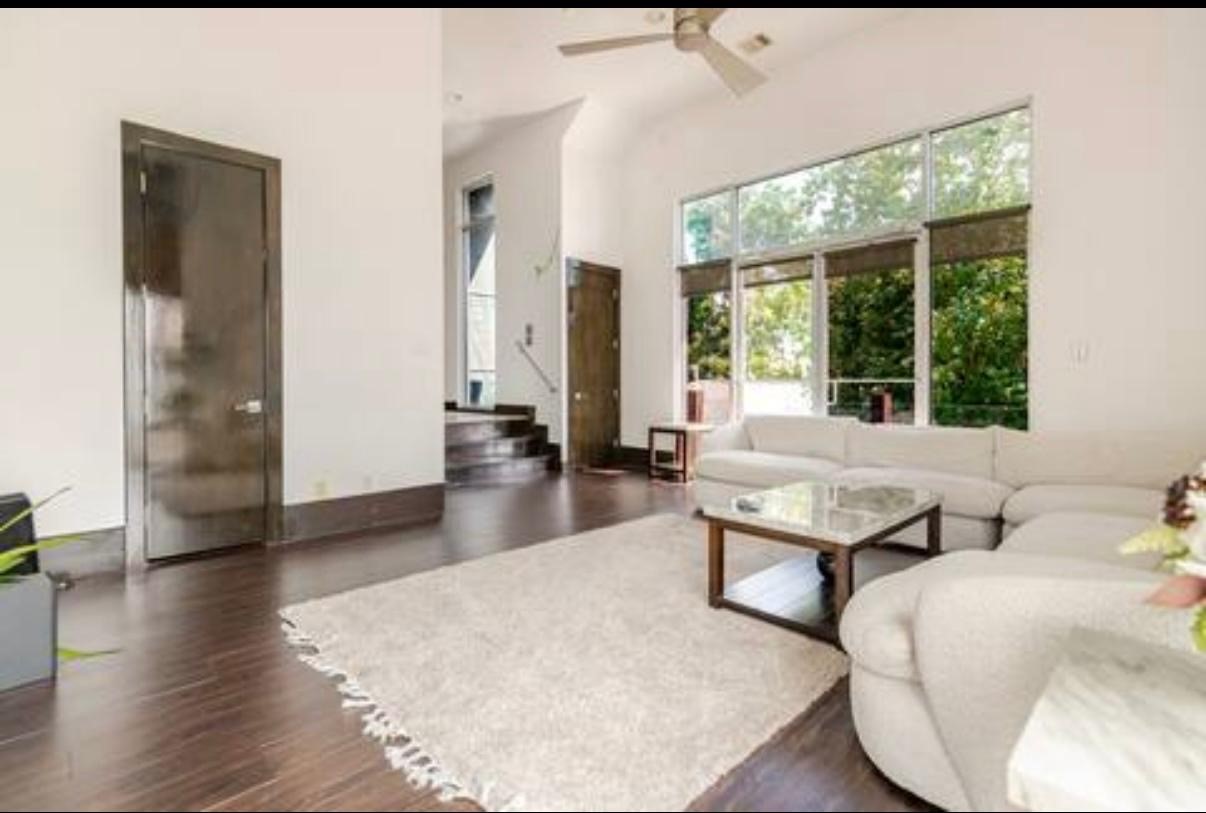 4118 Floyd Street, Unit A Houston, TX 77007 - Photo 1 of 25 a living room with furniture and large windows