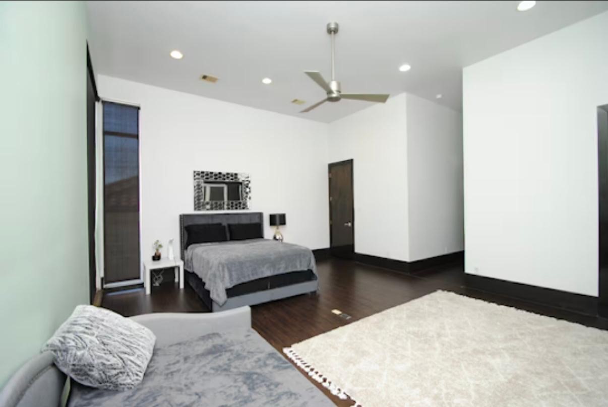 4118 Floyd Street, Unit A Houston, TX 77007 - Photo 16 of 25 a living room with furniture and a chandelier